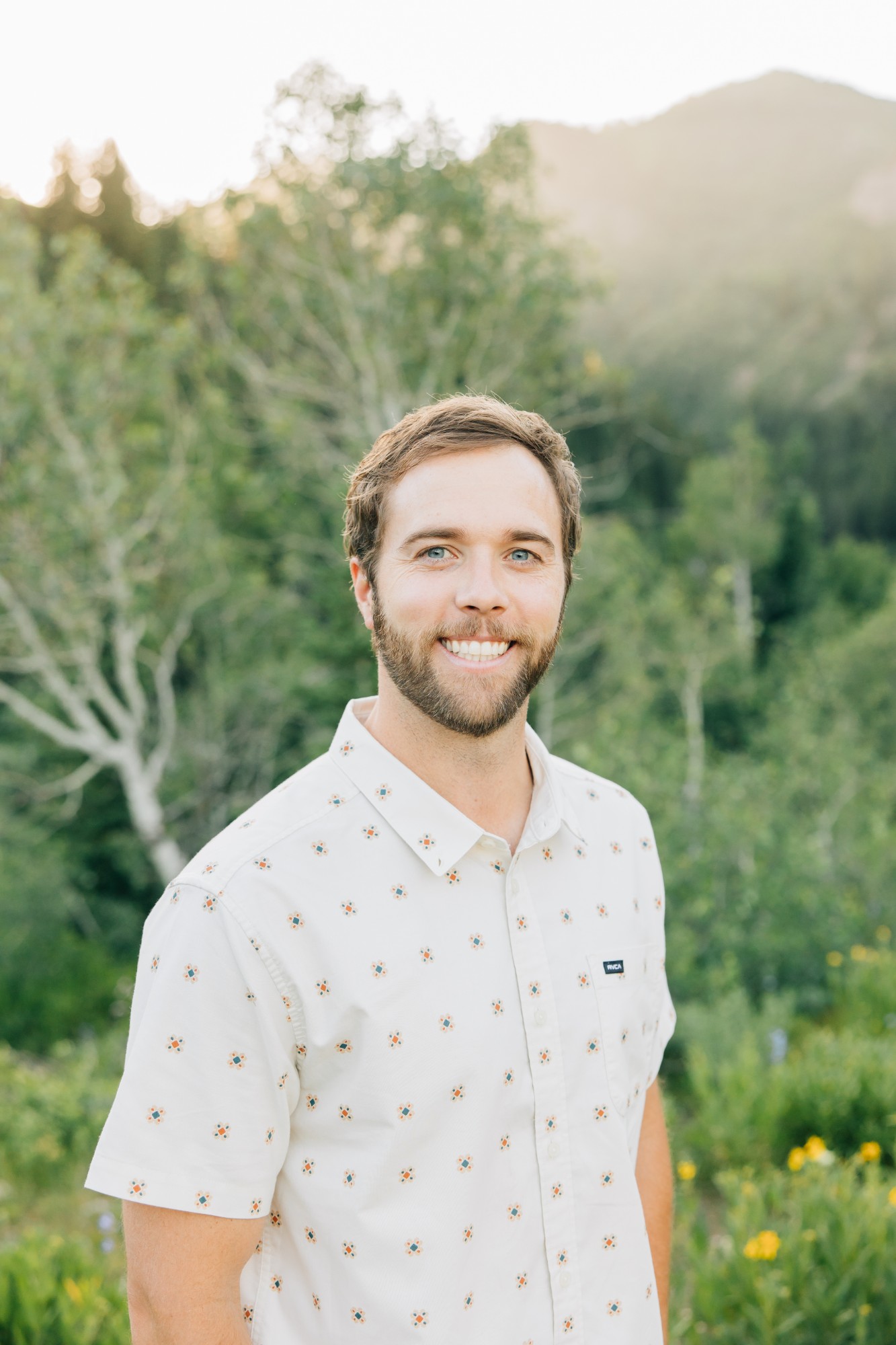 Lincoln Bradshaw, LCSW, smiling outdoors in the Wasatch mountains